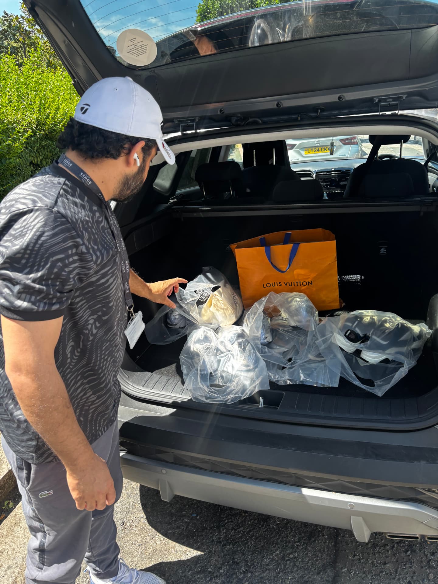 Bagged sneaker orders loaded in the car boot ready for delivery