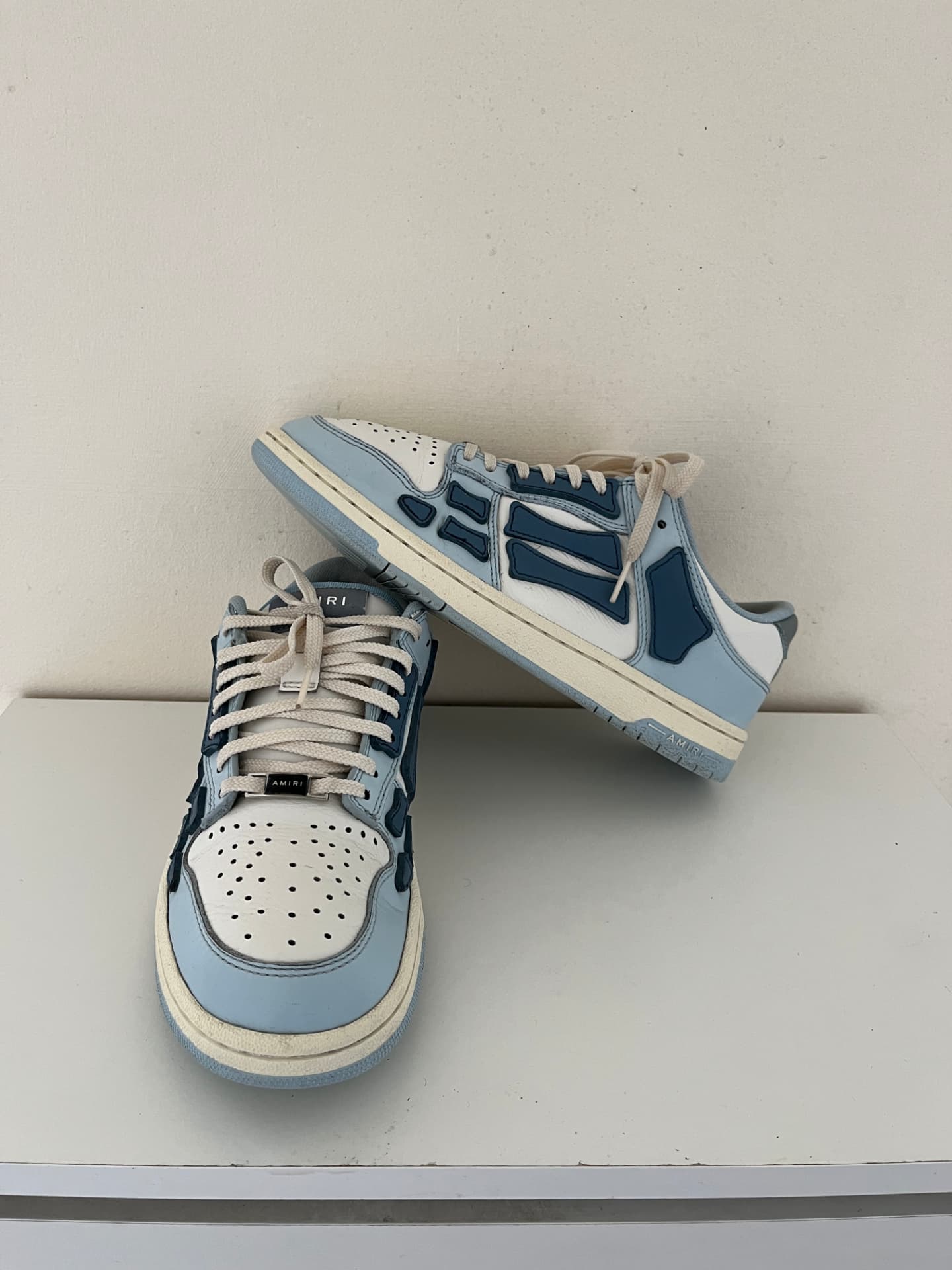 Restored blue and white Amiri Skel-Top Low sneakers with bright white midsoles